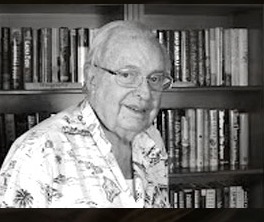 Henry Richter in later life, smiling in front of a bookcase