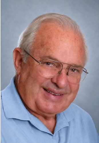 Henry Richter in later life, smiling, in a light blue shirt